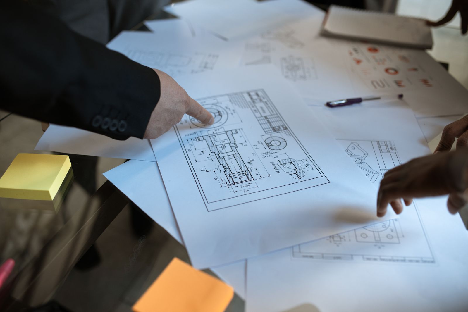Design team reviewing coordinated project drawings