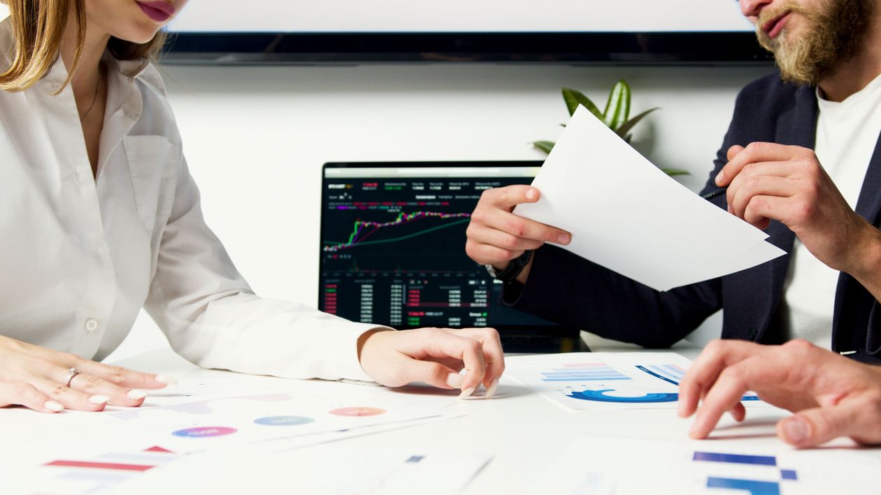 Finance professionals reviewing financial data together