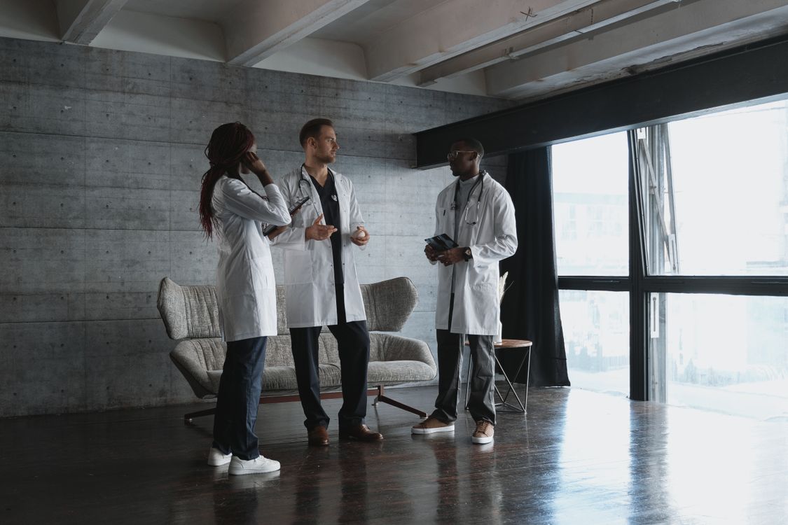 Healthcare professionals discussing a case in a modern clinic